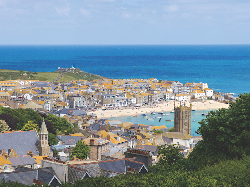 view of St Ives, Cornwall, from a viewpoint showing the town, beach and sea