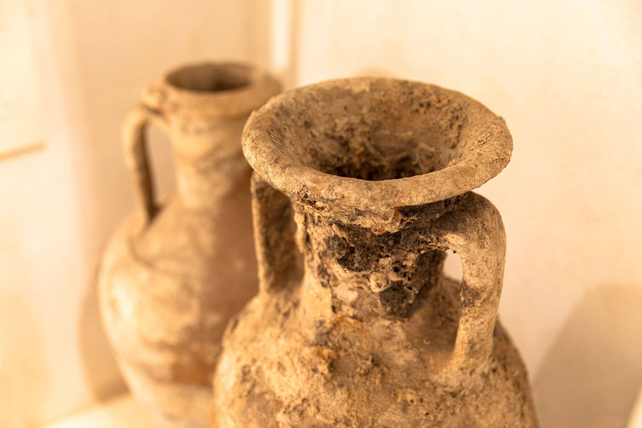 close up of two antiquated double-handled pots