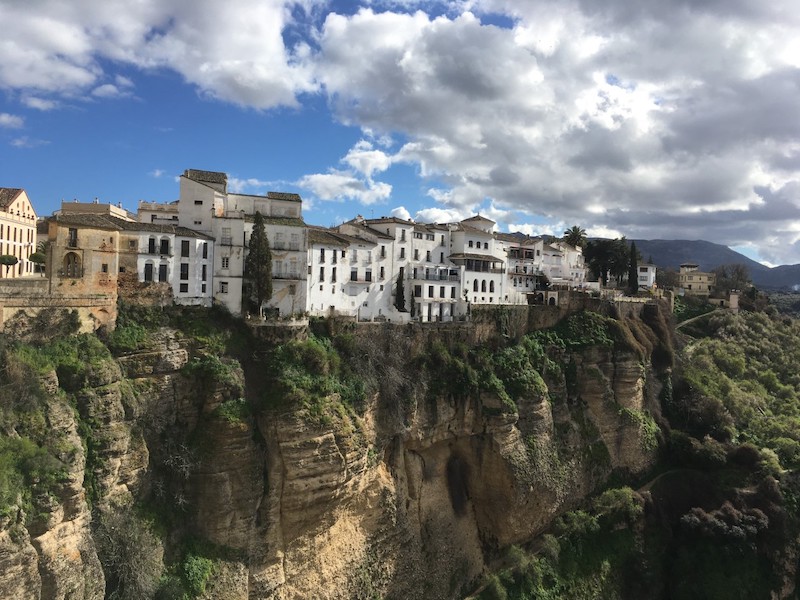 the cliffs of Ronda, Spain, with houses perched along the top