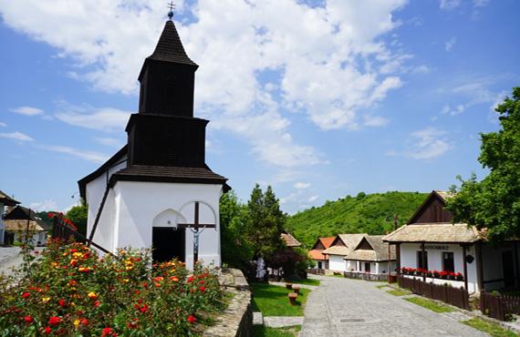 A small church features prominently in the 17th to 18th century Village of Hollókő.