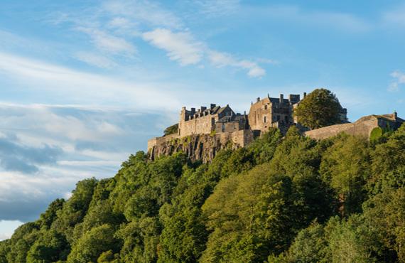 A view of the famous Stirling Castle during a day with few clouds.