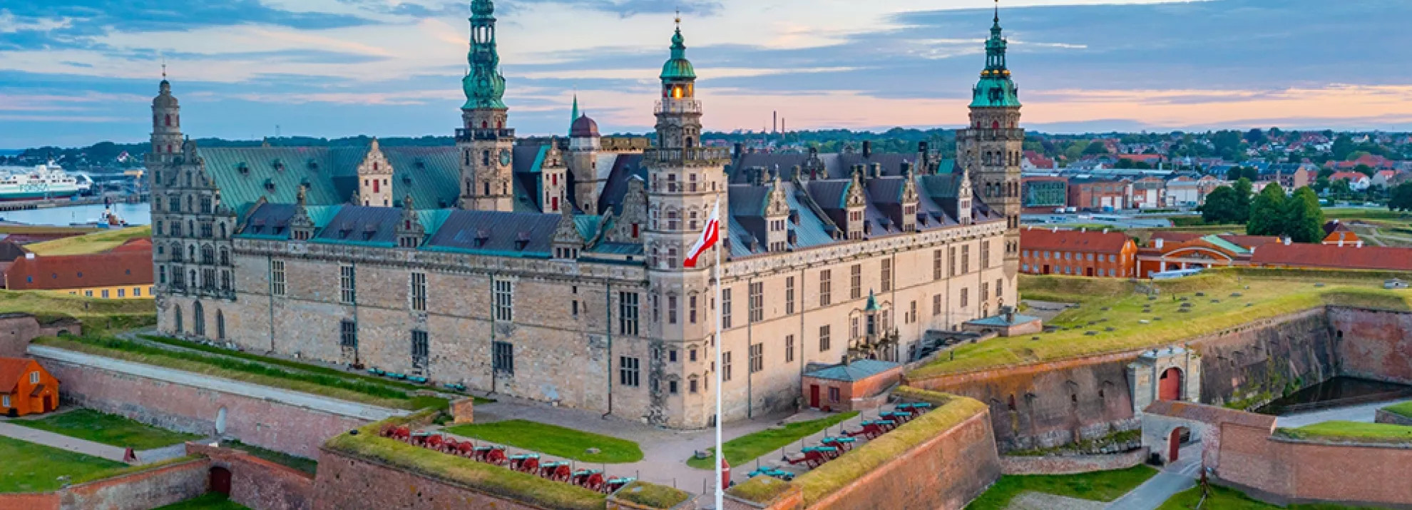 A landscape view of the grand Kronborg Castle in Helsingør, Denmark. 