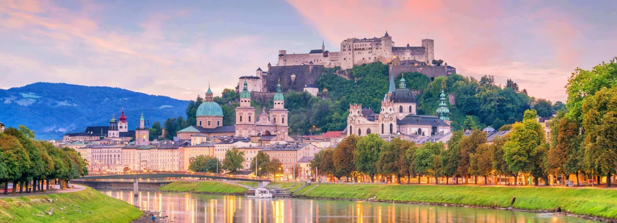 beautiful view of salzburg city skyline in the summer with pink and lilac clouds