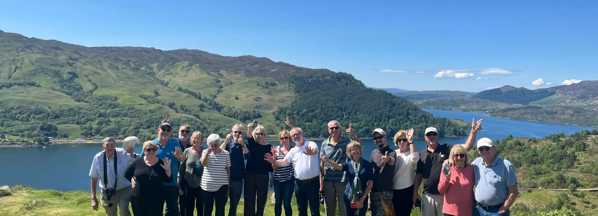 A tour group taking a photo during the a Scottish Journey tour