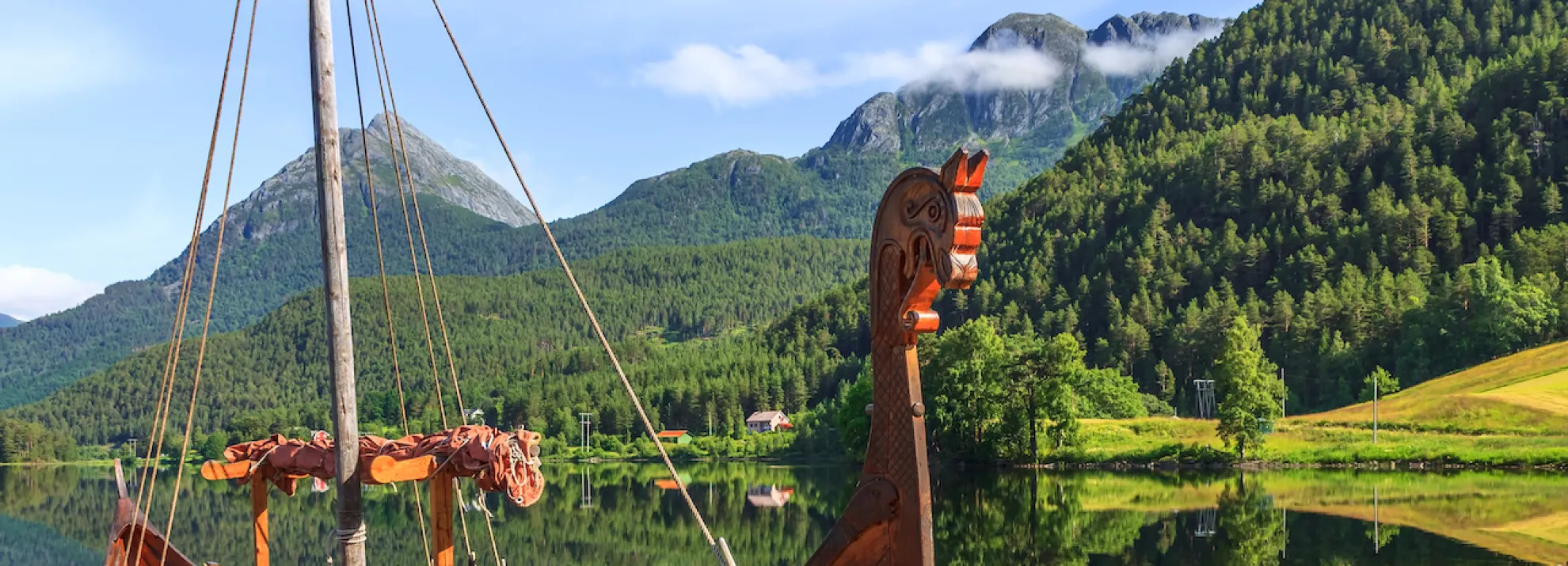 A viking ship on a beautiful scenic river