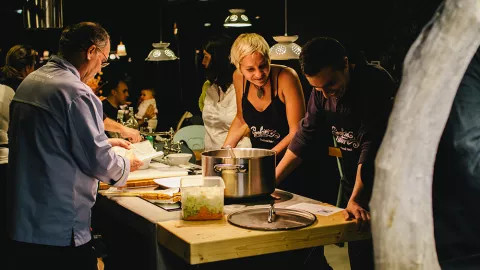Travelers engaging in a cooking class at a hotel in Portugal.