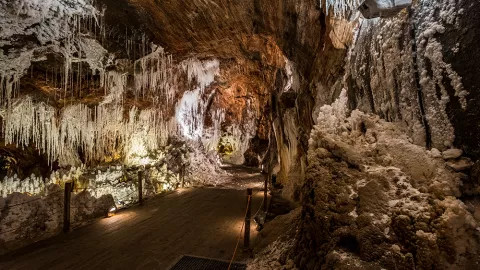 A view of a cavern within the Cardona salt mountain, with stalactites hanging from the ceiling.
