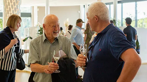 Guests enjoying a wine tasting in Tuscany, Italy.