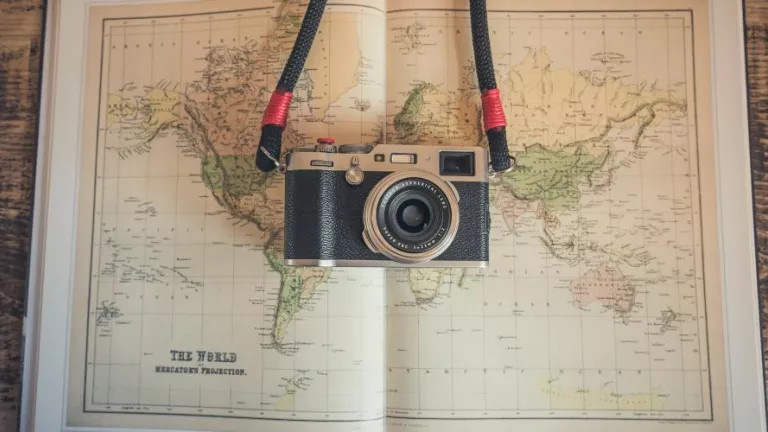 Camera hanging over world map