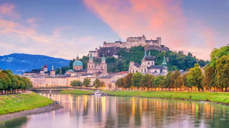 beautiful view of salzburg city skyline in the summer with pink and lilac clouds