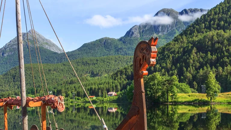 A viking ship on a beautiful scenic river