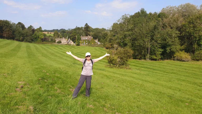 woman standing in green field