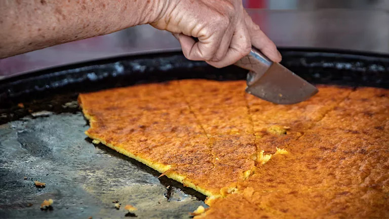 Traditional street food Socca being served in Nice, France