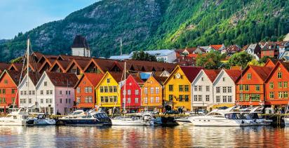 Colorful houses line the coast of the historical district of Bryggen, located in Bergen.