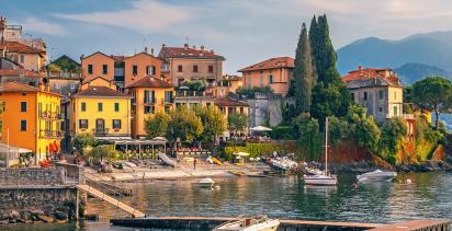 Coastal town across Lake Como during sunset.