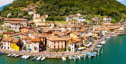 The small coastal town of town of Iseo with the river in the background.