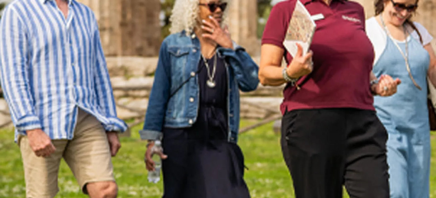Tour leader showing a small-group around Paestum in Italy