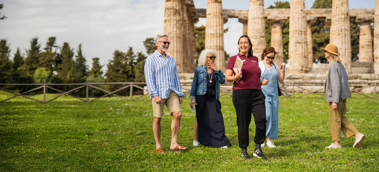 Tour leader showing a small-group around Paestum in Italy