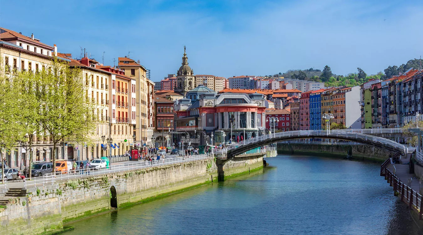 Landscape view of colourful buildings and the Nervion River in Bilbao, Spain