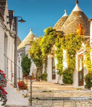 The colorful houses amongst cobblestone streets in Puglia.